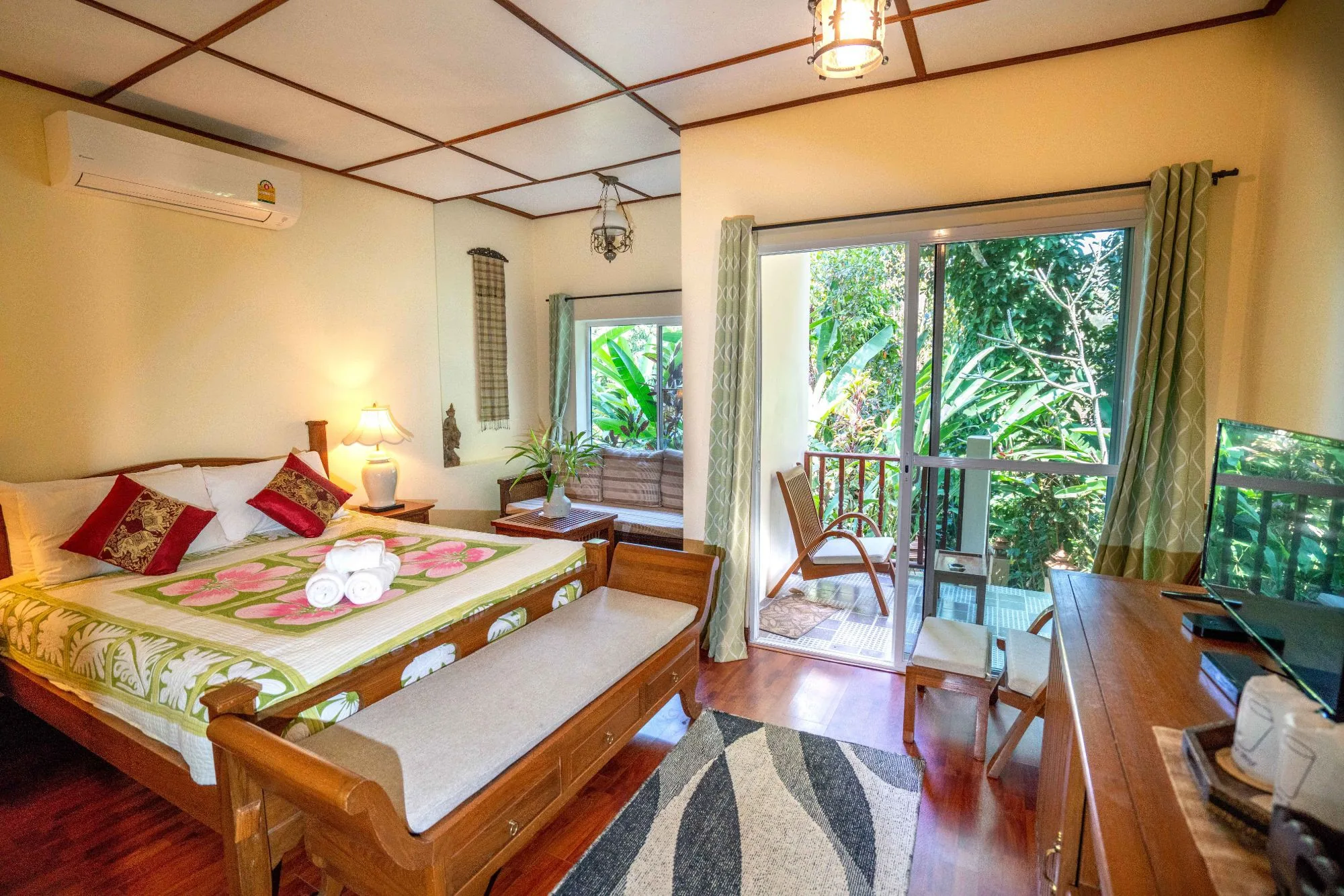 Wide view of Air Nest with bed, desk and balcony doors