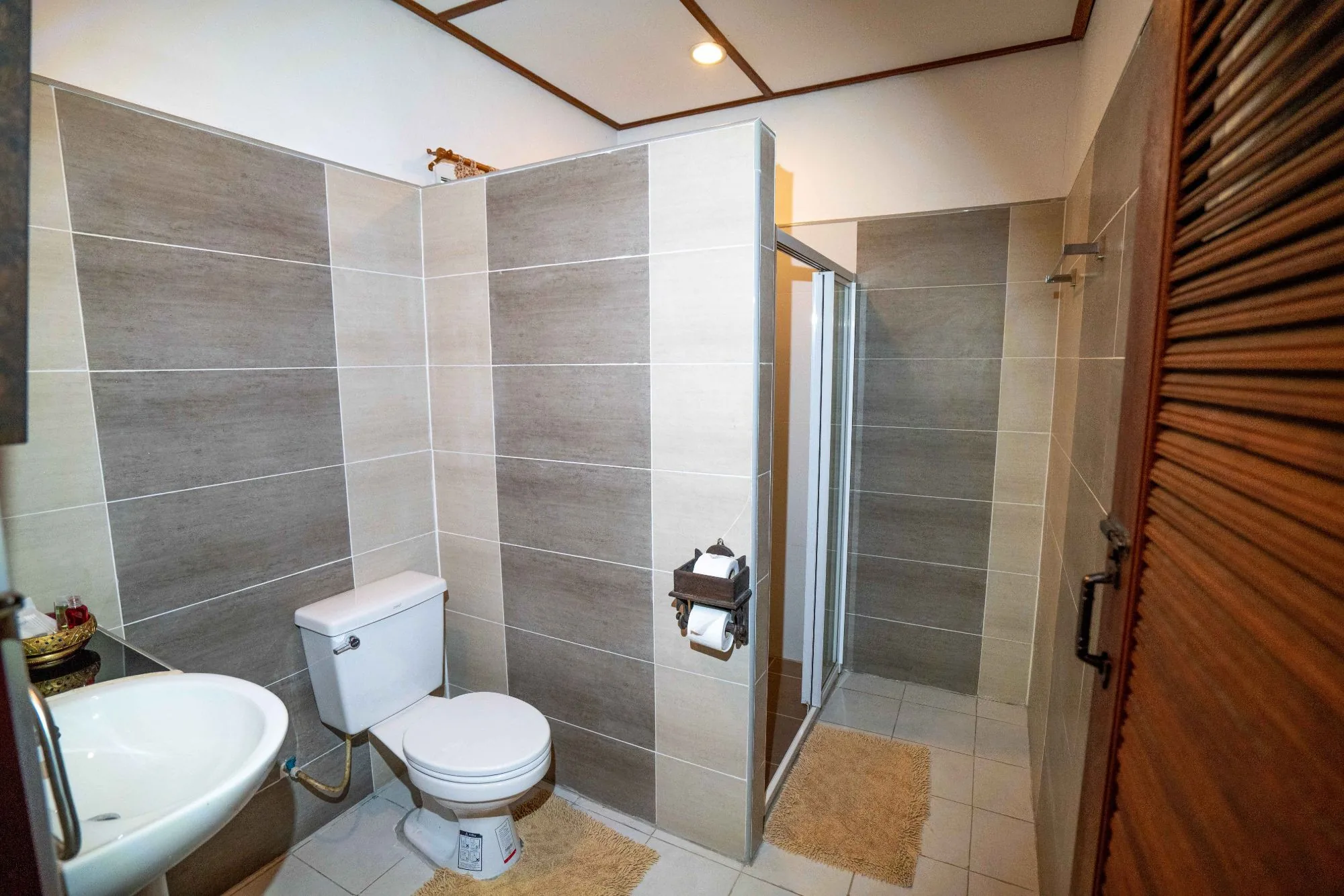 Air Nest tiled bathroom with walk-in shower