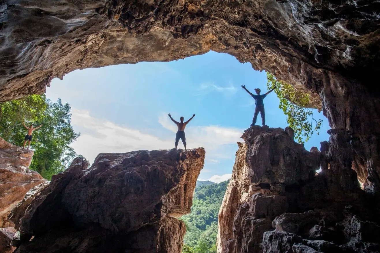 Cavers standing in the Red Cliff Cave arch